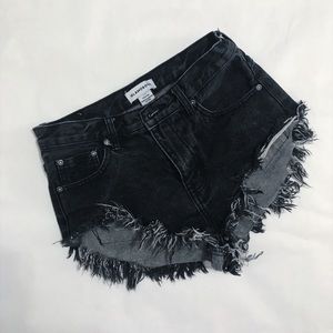 Black denim cutoff shorts.